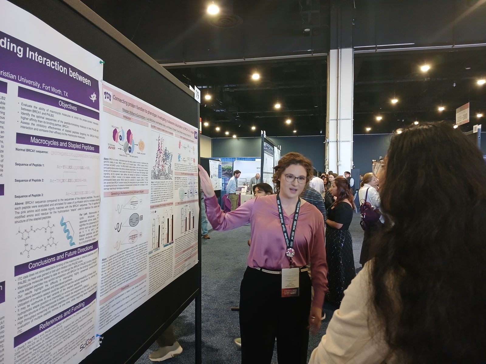 Meagan McMann presenting her poster on the ASBMB exhibit floor