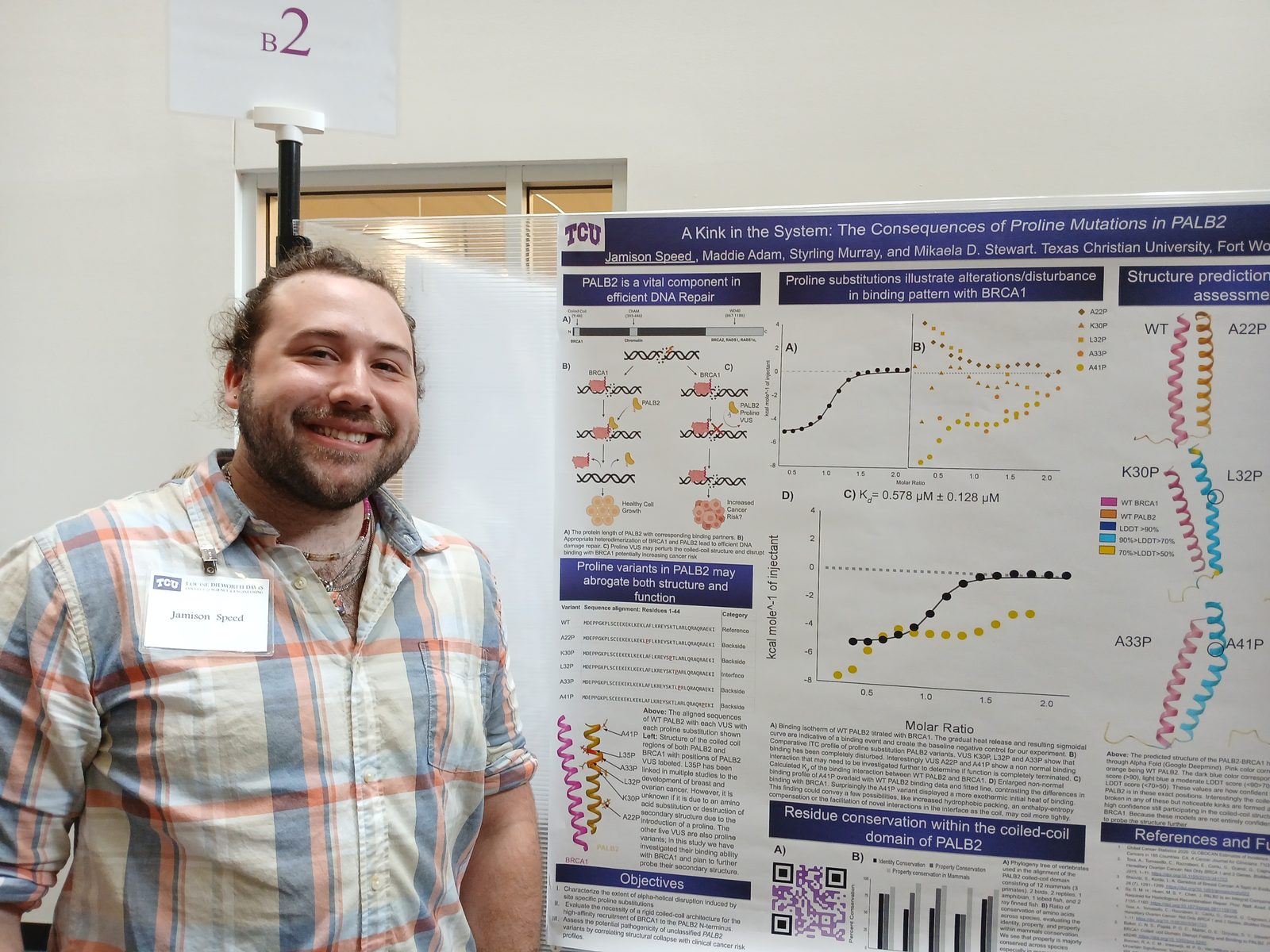 Student presenting the poster A Kink in the System