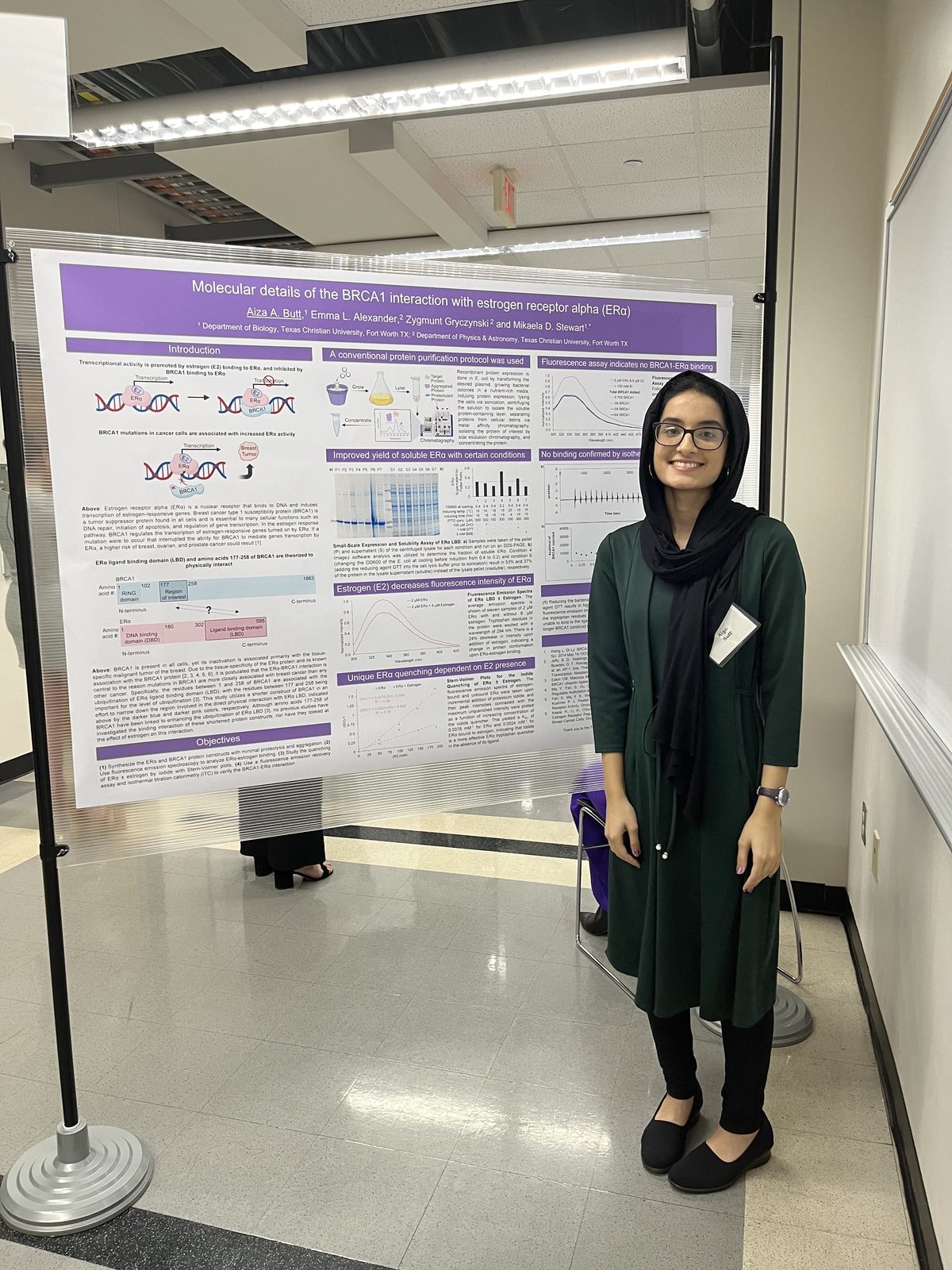 Aiza Butt beside her estrogen-receptor-alpha poster